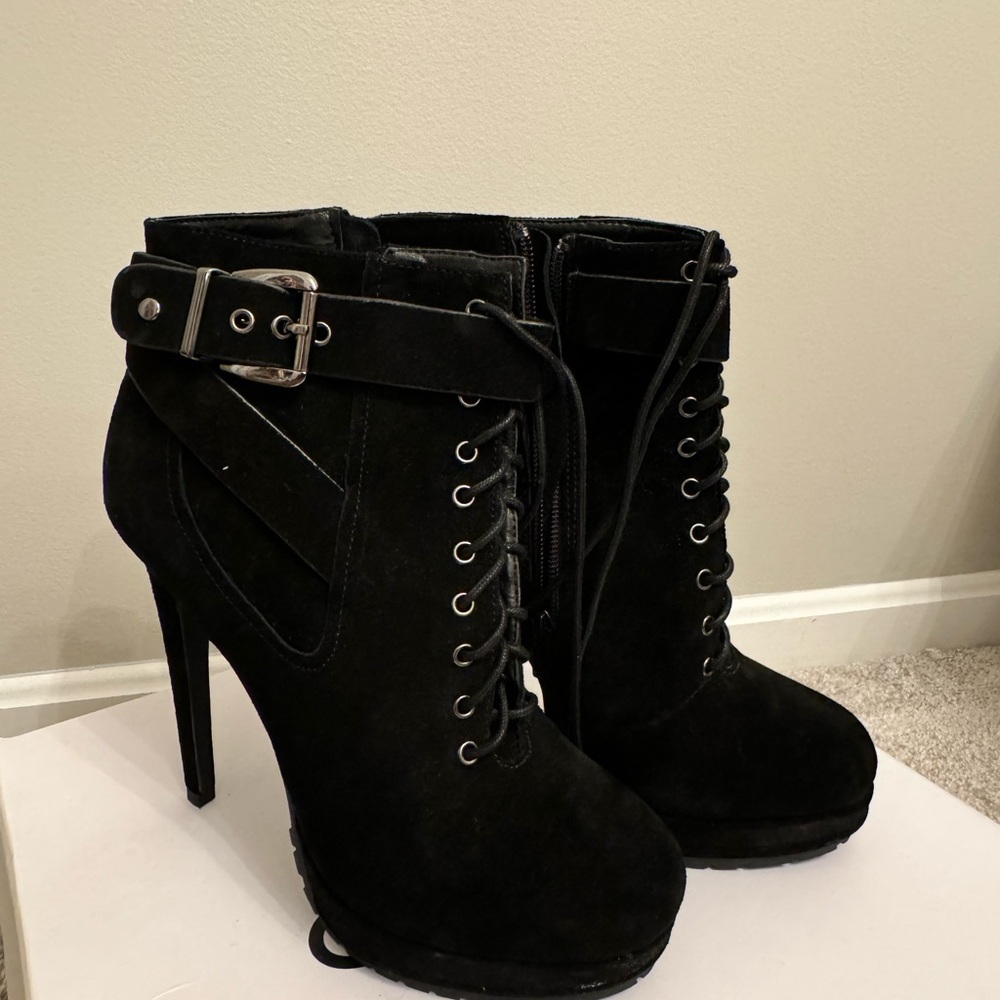 Black high heeled boots! Never worn size 8.5, box included